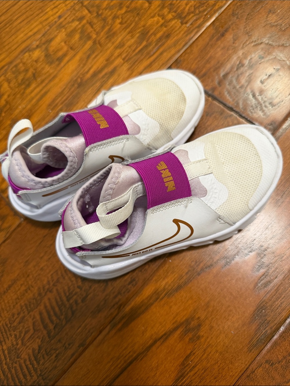 Nike Kids White and Purple Slip-On Sneakers with Gold Swoosh